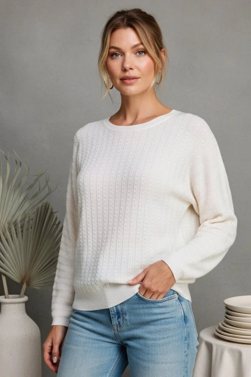 Cream-colored textured pointelle soft gauge dolman sweater