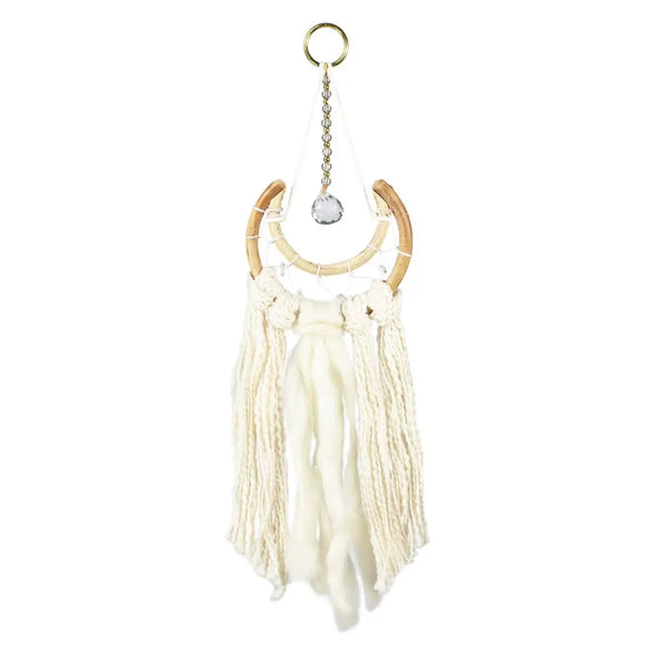Cream-colored macramé wall hanging with bamboo crescent and crystal accent for wall decor