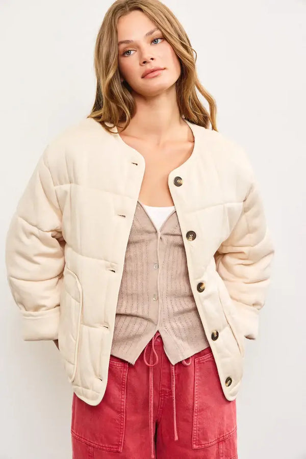 Cream-colored quilted oversized jacket with puffy sleeves for stylish outerwear