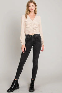 Cream-colored Center Ruched Micro-Rib Knit Top with black skinny jeans and combat boots