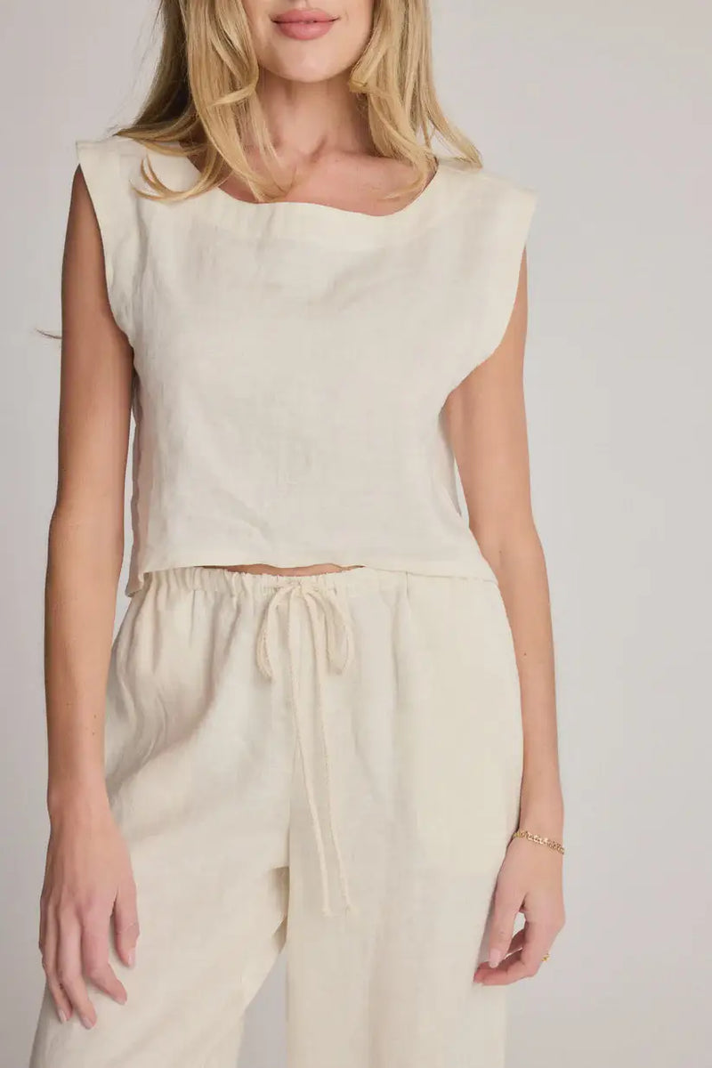 Cream-colored sleeveless top and drawstring pants from SUNDAY RITUAL ELENA TOP, a women’s boho chic clothing essential for shop daisy and womens boho