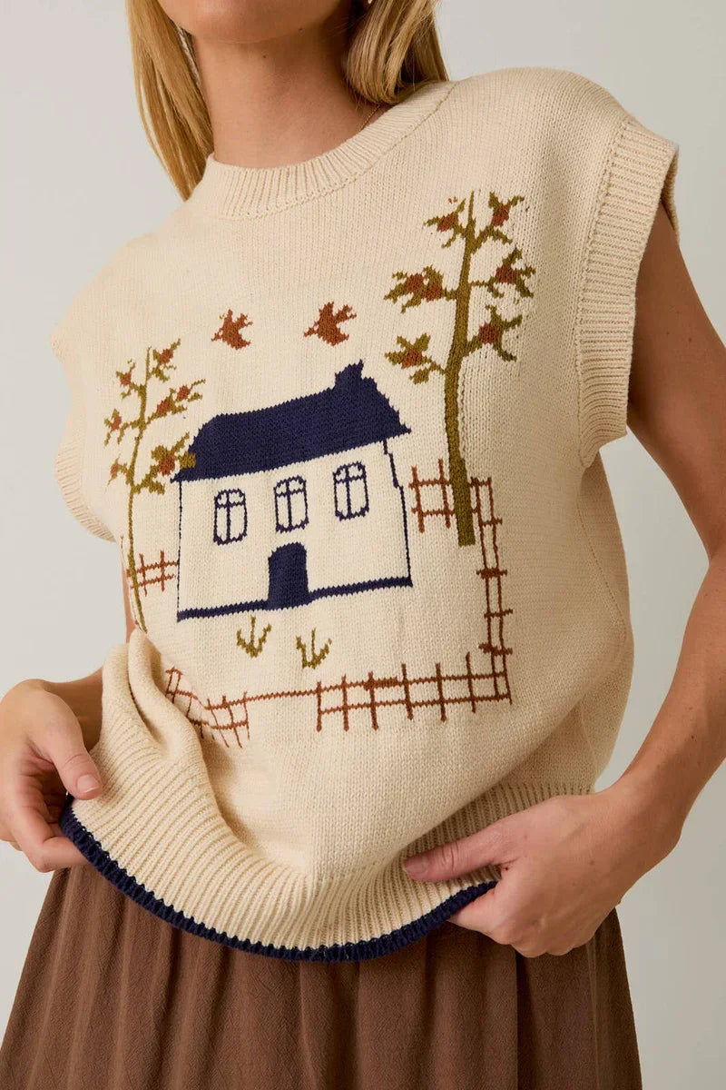 Cream-colored crow neck sleeveless graphic sweater with house and tree design