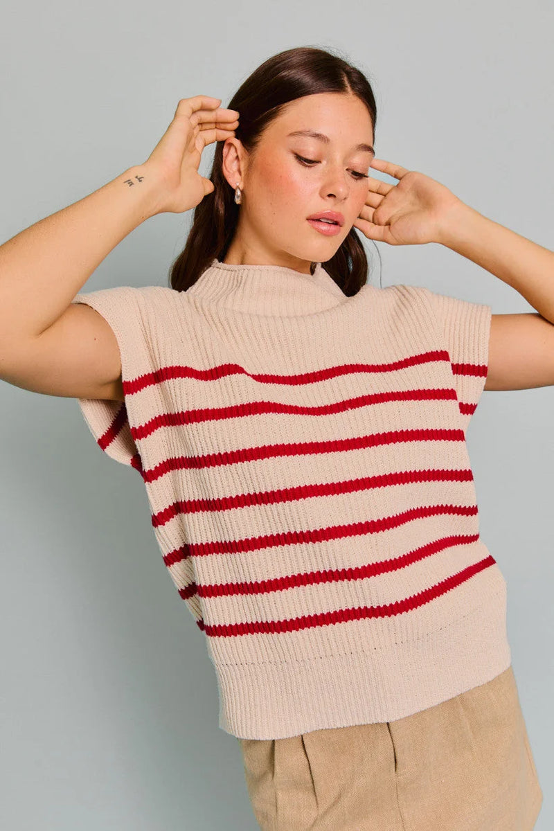 Cream-colored turtle neck sweater vest with red stripes in women’s boho chic clothing