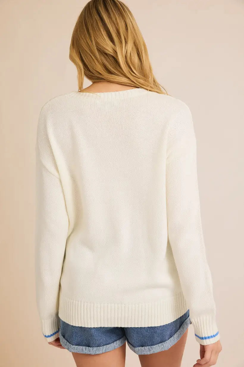 Cream-colored round neck long sleeve beach sweater with blue trim for women