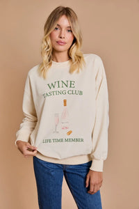 Cream-colored sweatshirt with Wine Tasting Club Lifetime Member text in womens boho clothes