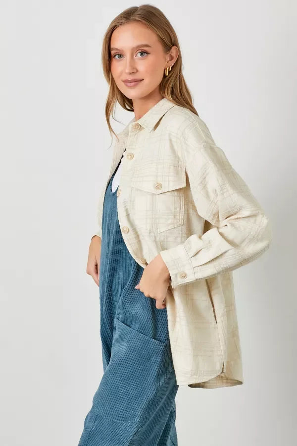 Cream-colored plaid texture woven shacket with front pockets and a collar