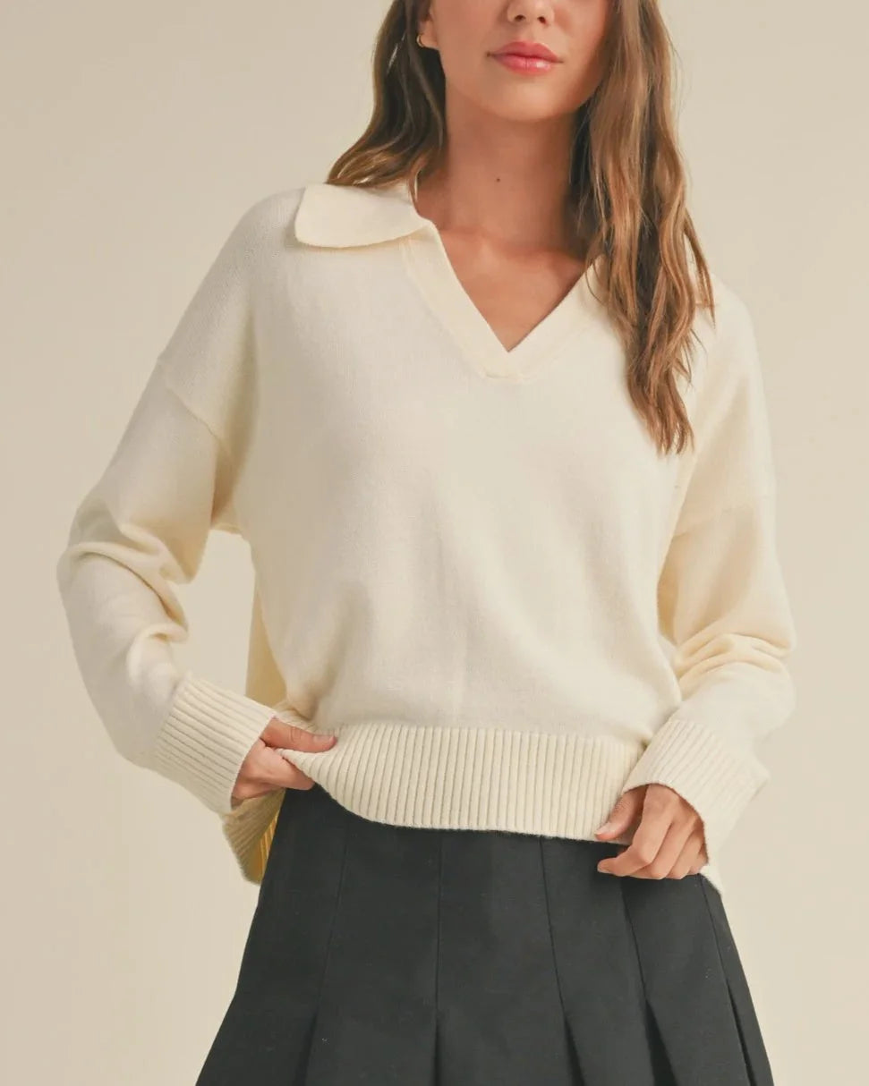 Cream-colored v-neck collared soft sweater for women’s boho chic clothing at Shop Daisy