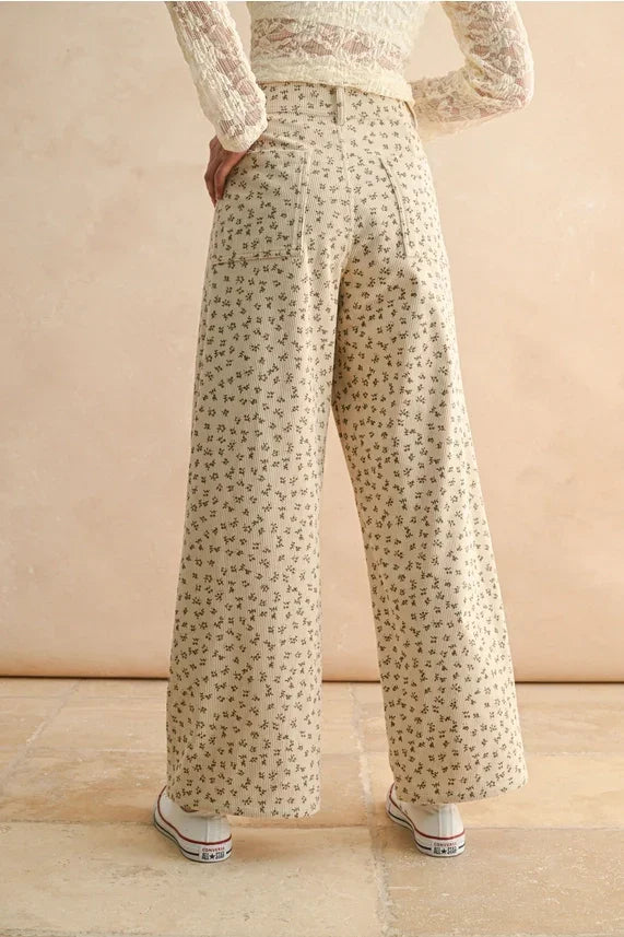 Cream-colored floral printed corduroy pants with wide-leg design for a stylish look