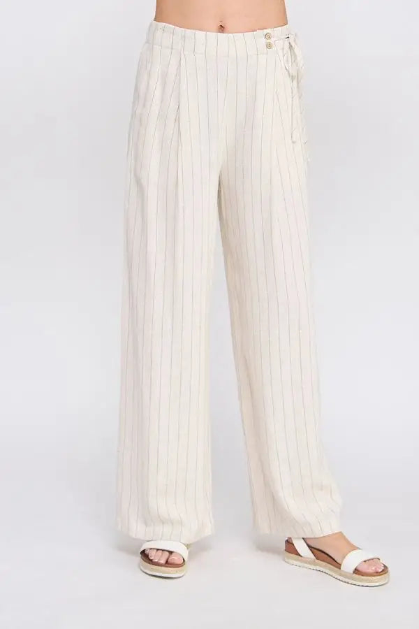 Cream-colored wide-leg pants for women’s boho chic clothing from Shop Daisy