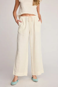 Cream-colored wide-leg pants from SUNDAY RITUAL DAHLIA PANTS, perfect for women’s boho chic clothing and shop Daisy selections