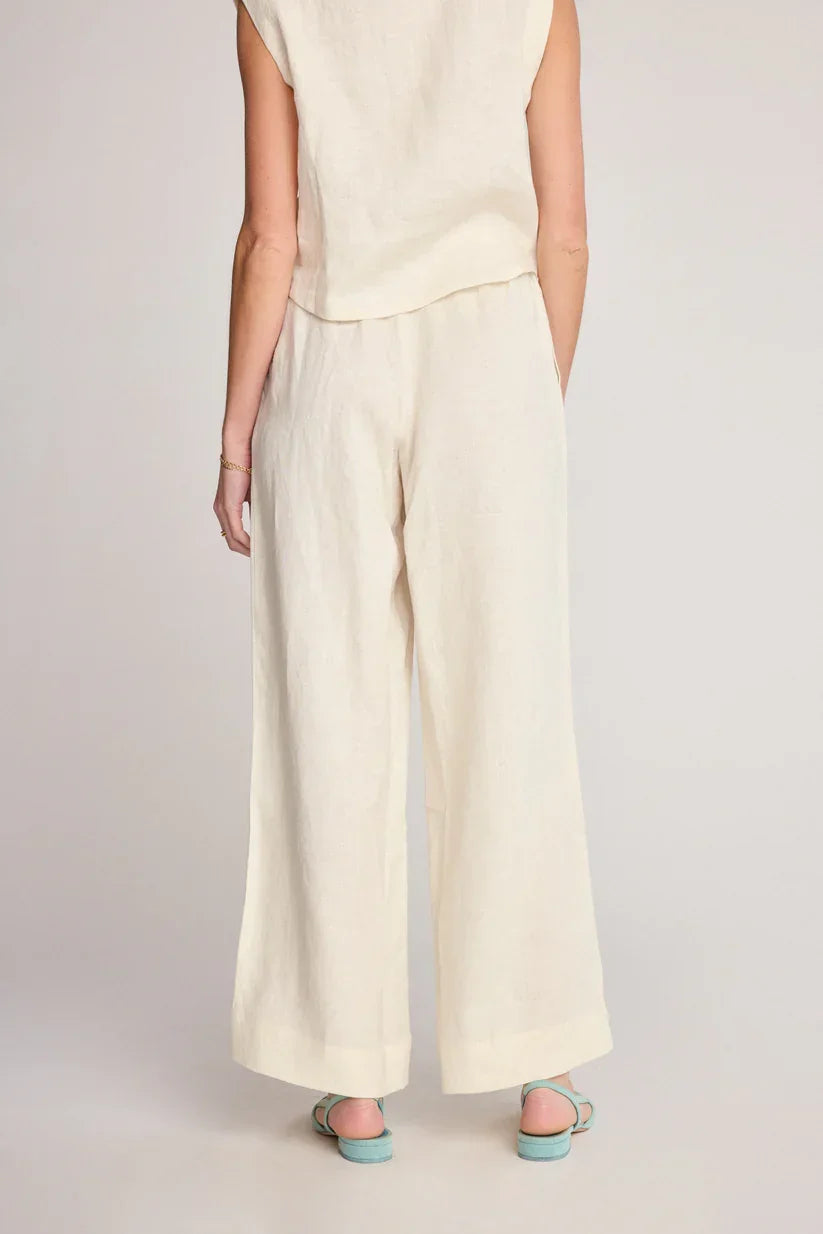 Cream-colored wide-leg pants from SUNDAY RITUAL DAHLIA PANTS, ideal for women’s boho chic clothing