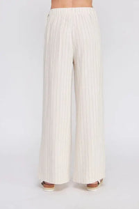 Cream-colored wide-leg pleated pants for women’s boho chic clothing from Shop Daisy