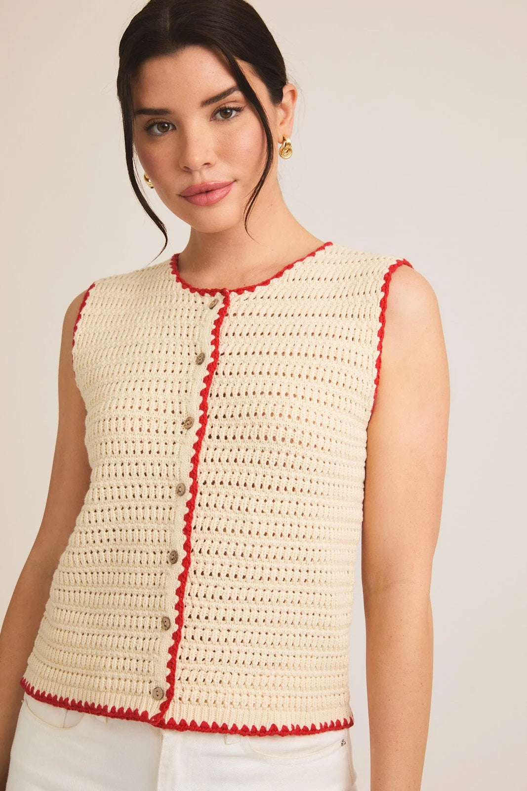 Cream crochet sleeveless top with red trim and button details for stylish summer wear