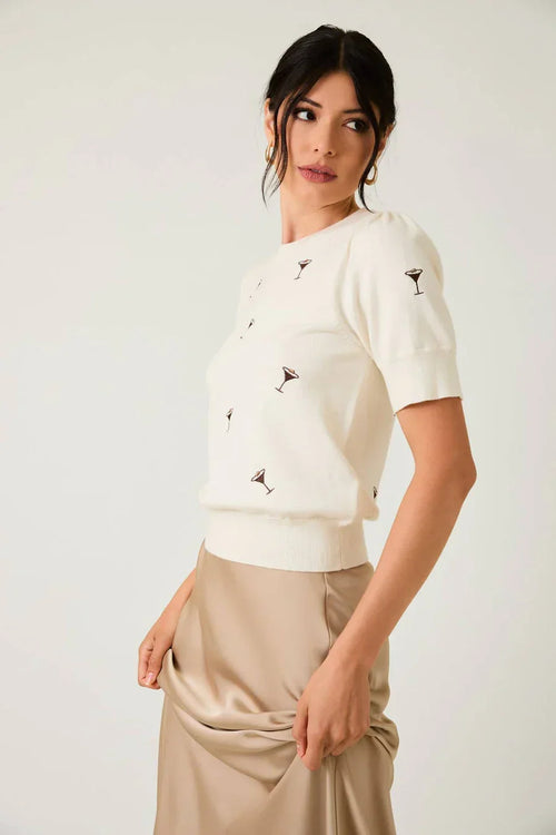 Cream short-sleeved puff sleeve embroidered knit top with black floral embroidery