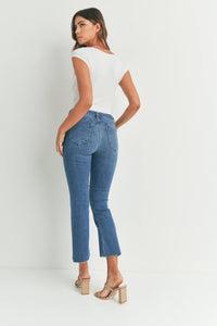 Cropped flare denim showcasing blue jeans with a straight leg cut and raw hem