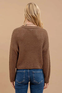 Cropped brown crochet knit sweater on a woman with long blonde hair, women’s boho chic clothing