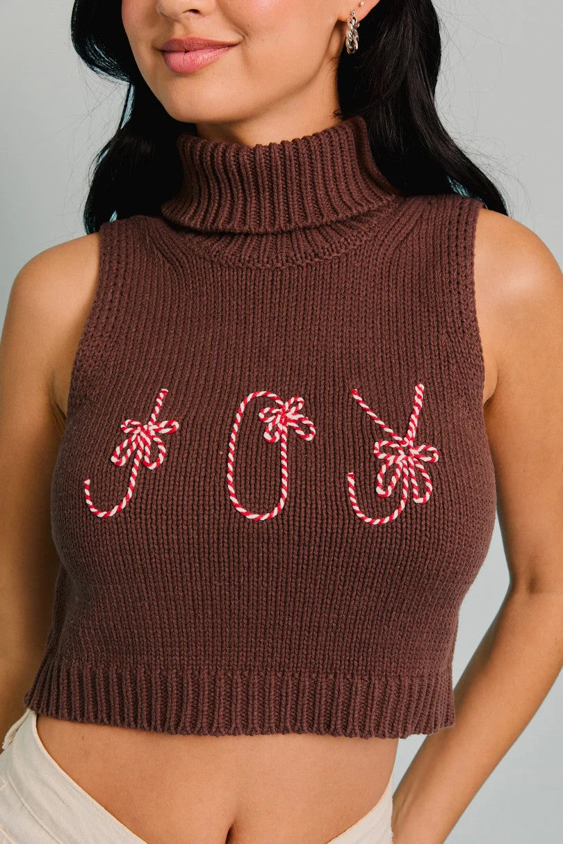 Cropped brown turtleneck sleeveless top with festive candy cane decorations