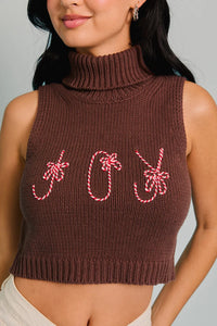 Cropped brown turtleneck sleeveless top with festive candy cane decorations