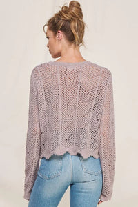 Cropped lavender long sleeve chevron pointelle sweater with scalloped hem detail