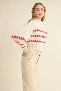 Cropped white COLOR POPPED SWEATER with red heart patterns and puffed sleeves