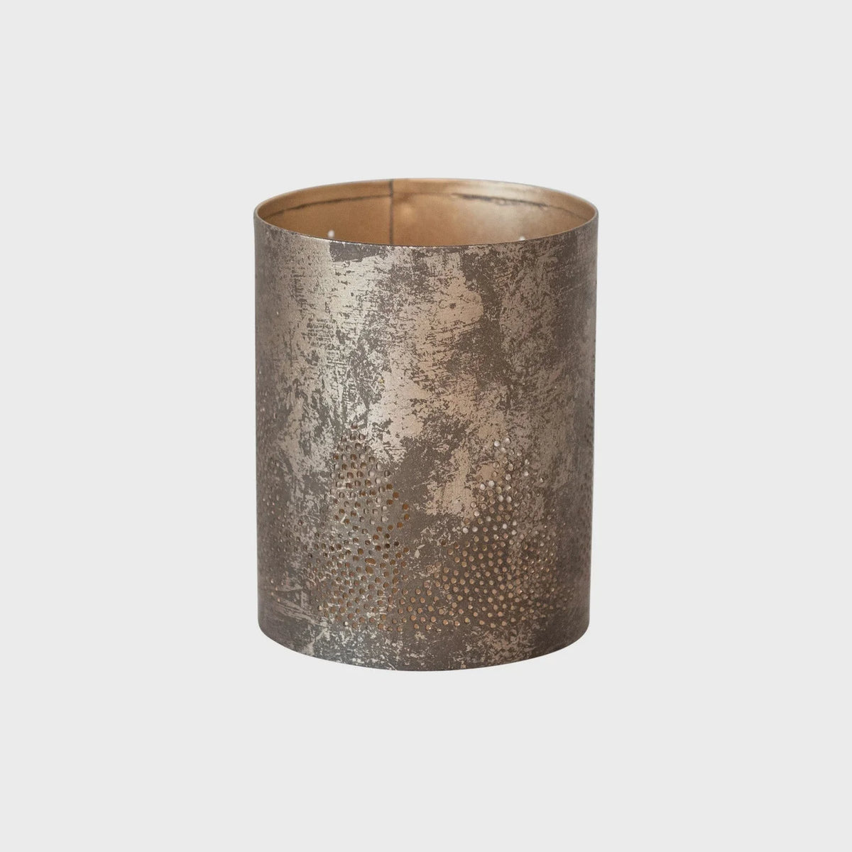 Cylindrical metal votive holder with textured metallic finish and tree cut-outs