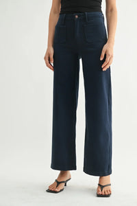 Dark blue mini patch pocket wide jeans with button closure