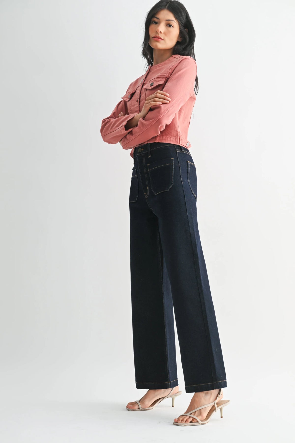 Dark blue wide leg denim jeans with white contrast stitching and patch pockets