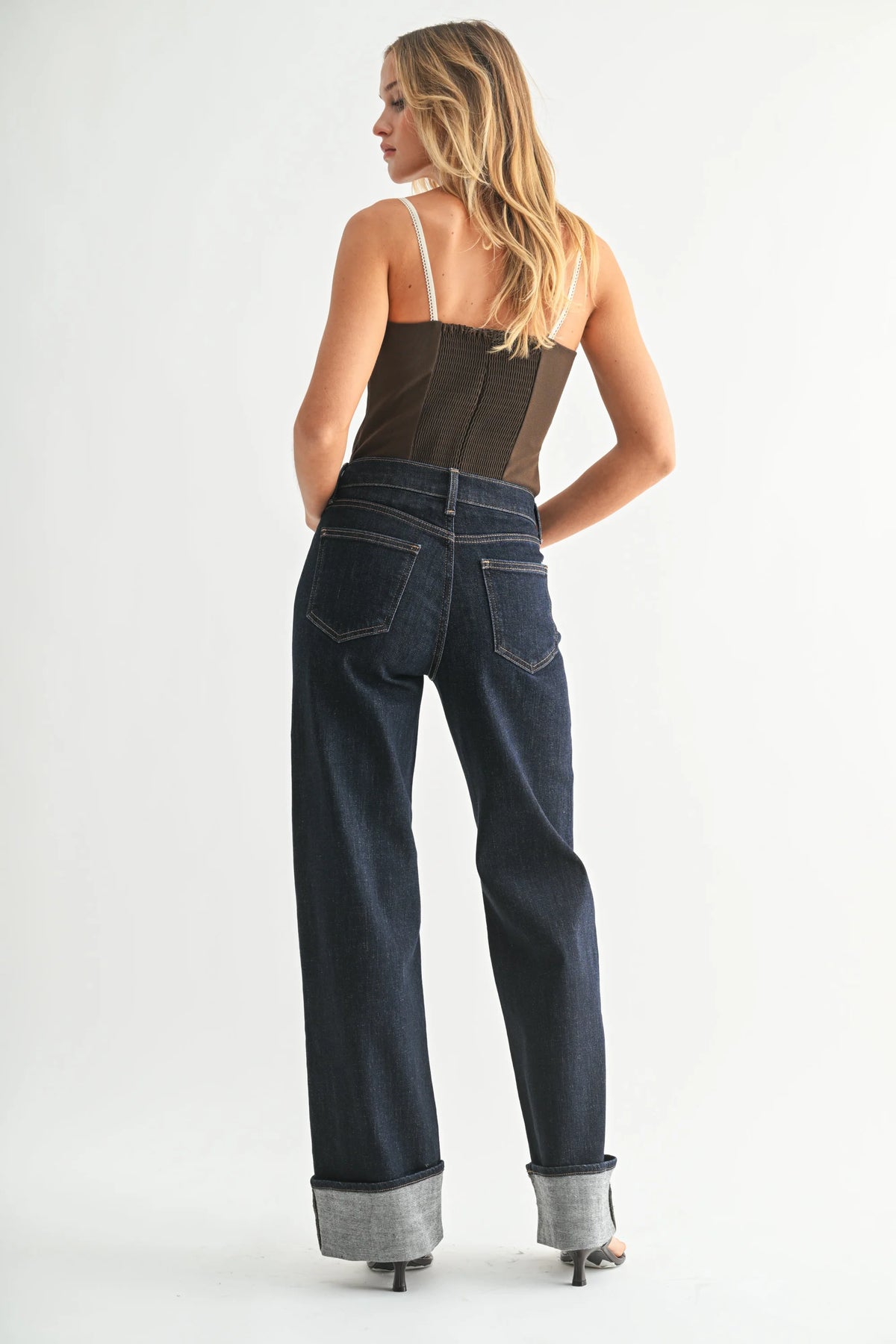High rise cuffed wide leg jean in dark denim with brown leather waistband