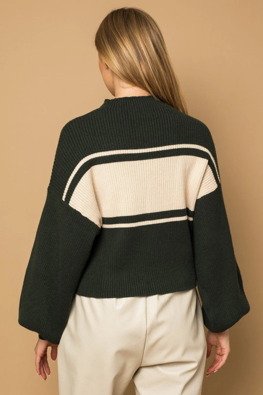 Dark green contrast stripe mock neck sweater with cream horizontal stripes on the back