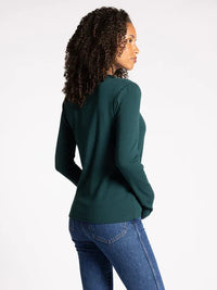 Dark green long-sleeved turtleneck sweater featuring ribbed ultra soft texture