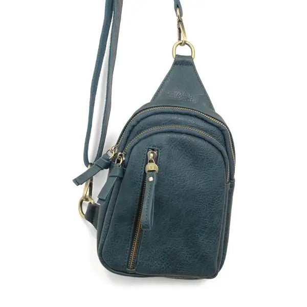 Dark teal vegan leather Skyler Sling Bag with a convertible strap for versatile use