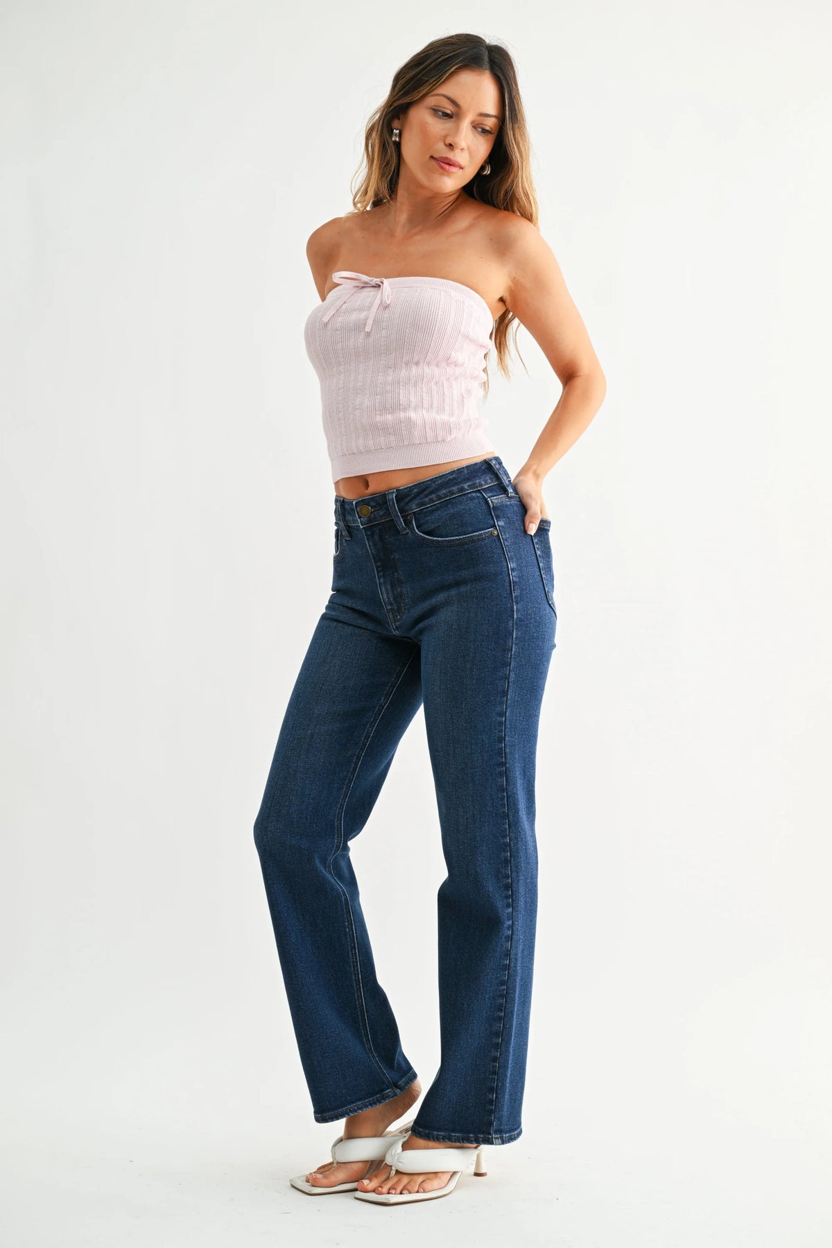 Mid rise straight leg denim jean with high waist and button fly