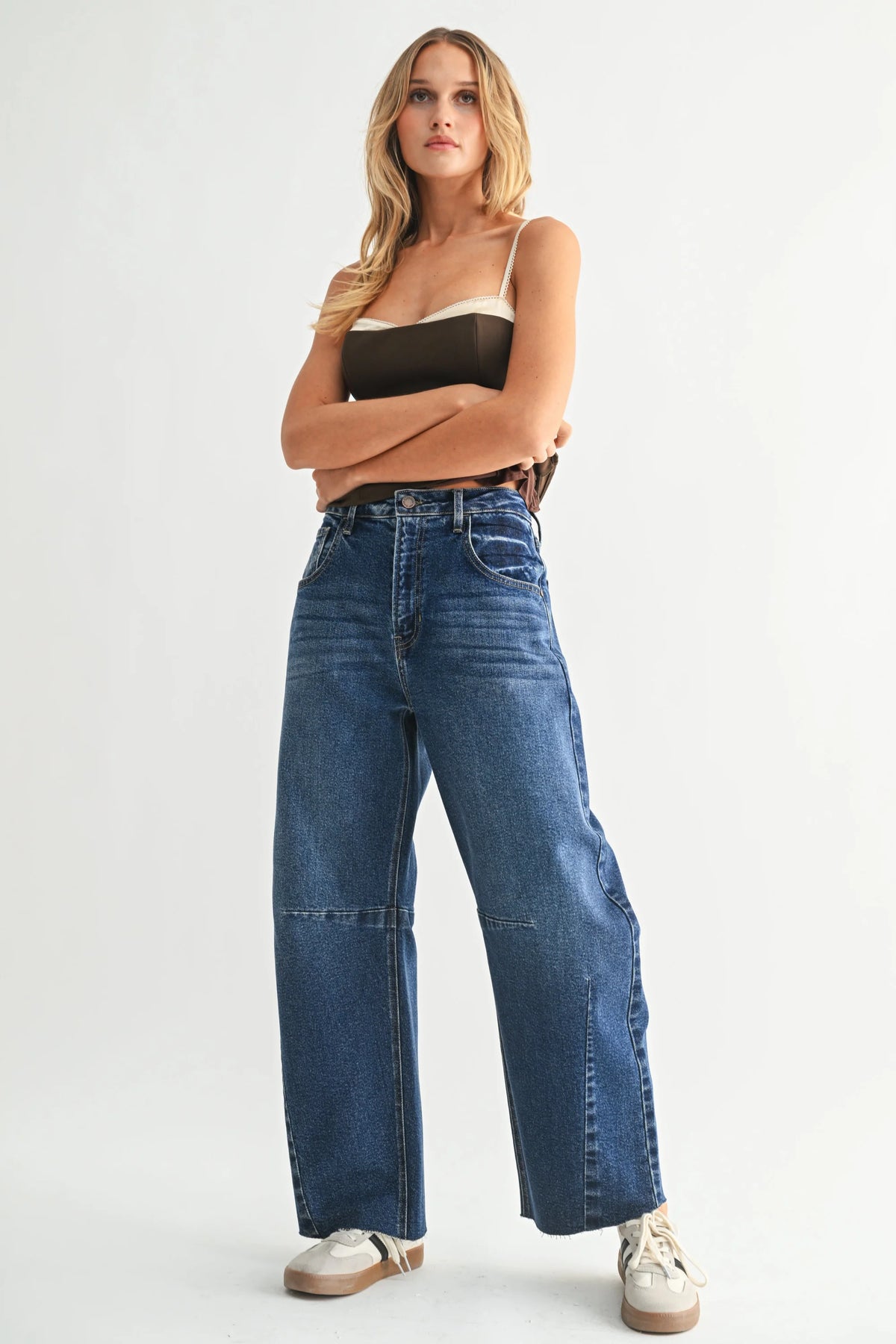 Dark wash wide leg denim jeans with visible knee seams from THE SEAMED BARREL WILD LEG DENIM JEANS