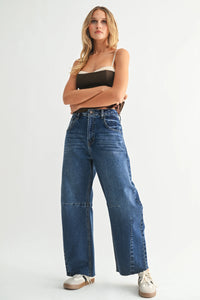 Dark wash wide leg denim jeans with visible knee seams from THE SEAMED BARREL WILD LEG DENIM JEANS