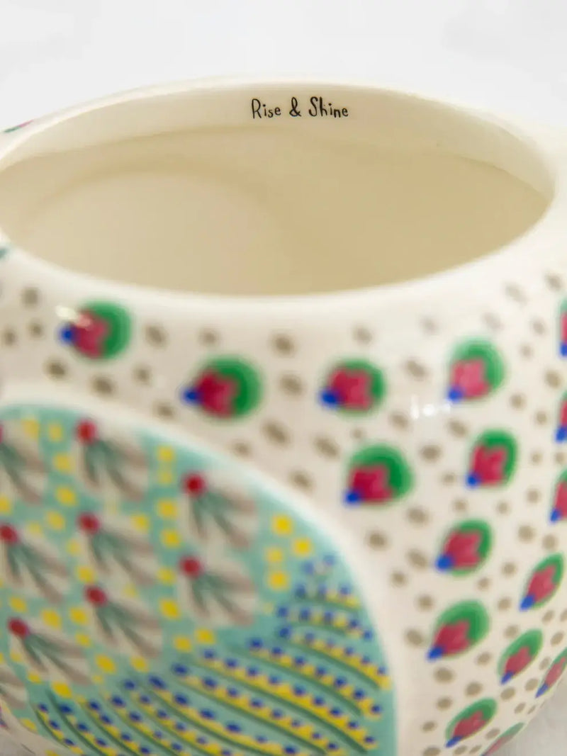 Decorated ceramic container featured in a Chicken Folk Art Mug with vibrant designs