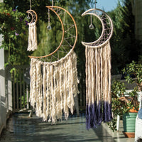 Decorative crescent moon dream catcher with macramé tassels and crystal ornaments from Shop Daisy