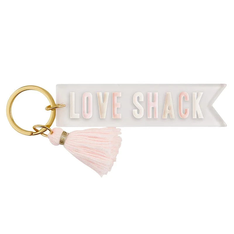 Decorative keychain featuring LOVE SHACK text and pink tassel perfect for boho free spirit