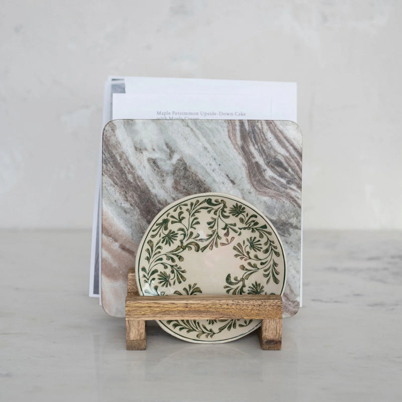 Decorative plate with green floral pattern on mango wood stand for stylish decor