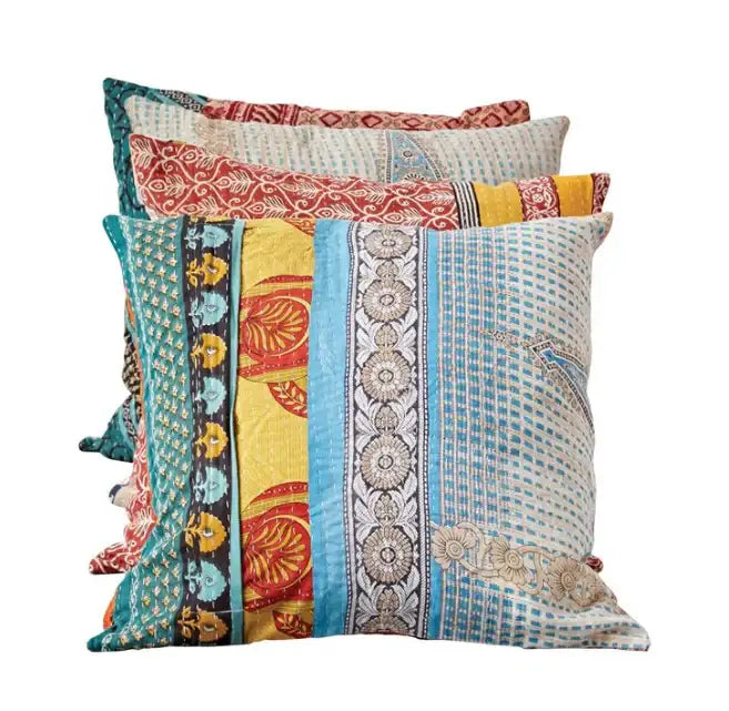 Decorative throw pillow with colorful striped patterns in teal, yellow, and coral fabrics