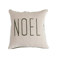 Decorative cotton knit holiday pillow featuring NOEL in dark letters on light fabric