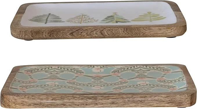 Decorative wooden serving trays with tree and floral designs, perfect for boho chic decor