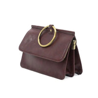 Deep red ARIA RING BAG with widest point gold-tone ring handle and interior zip