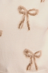 Delicate bow pattern on light fabric in ROUND NECK RUFFLE SLEEVE BOWS KNIT TOP from Shop Daisy