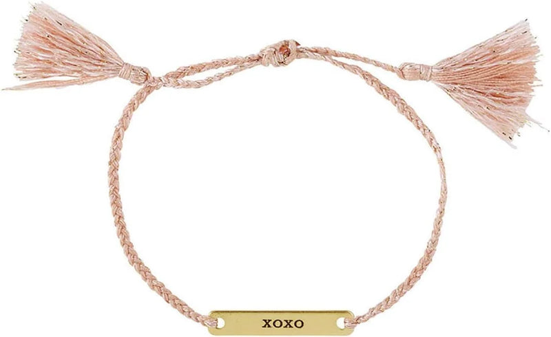 Delicate braided JOY IN A JAR BRACELET with XOXO gold bar and pink tassels for women’s boho chic clothing