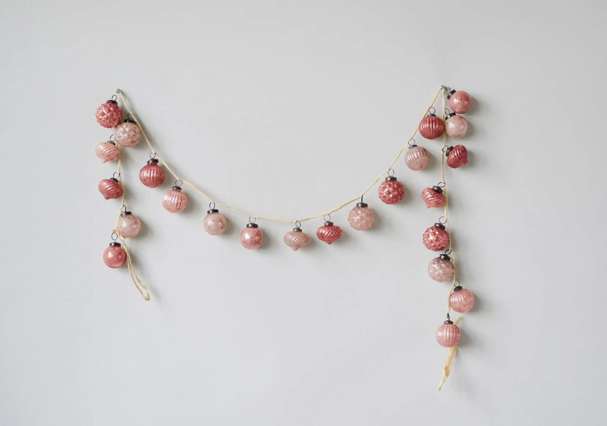 Delicate glass ornamental garland featuring pink and red strawberry-shaped beads