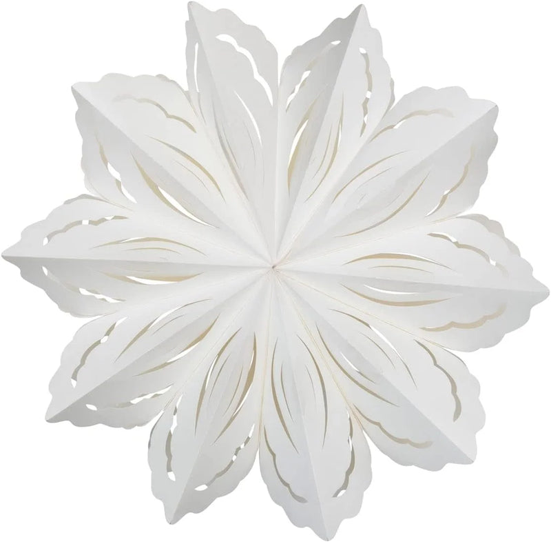 Delicate white paper snowflake ornament with intricate cut-out design for holiday decor