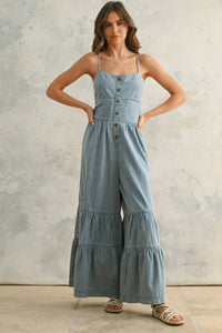 Denim button-front jumpsuit in chambray denim with tiered bottom detail