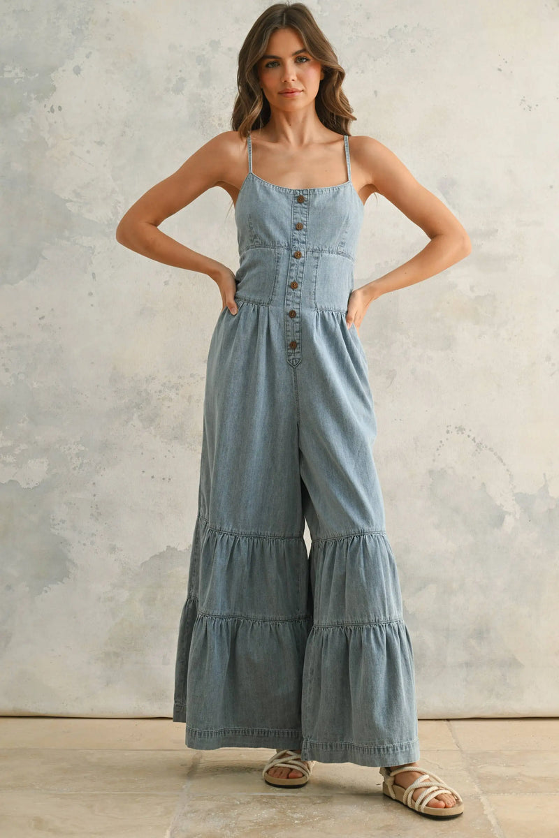 Denim button-front jumpsuit in chambray denim with tiered bottom detail