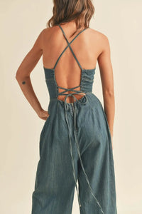 Denim jumpsuit with crisscross back in washed denim for a stylish look