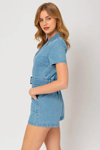 Young woman in a short sleeve denim romper with collar, showcasing boho fashion style